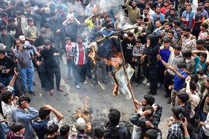 Kashmiri Shiite Muslim protesters shout slogans as they burn effigies of US President Donald Trump and Israeli Prime Minister Benjamin Netanyahu during a protest rally against the killing of the Iranian Supreme Leader, Ayatollah Ali Khamenei, in Budgam, about 25kms from Srinagar. Protests continue across the Kashmir valley over the killing of Iran's Supreme Leader Ayatollah Ali Khamenei in a coordinated US-Israeli airstrike on Tehran. Strict restrictions remained imposed in many areas of Kashmir for the fifth consecutive day.
