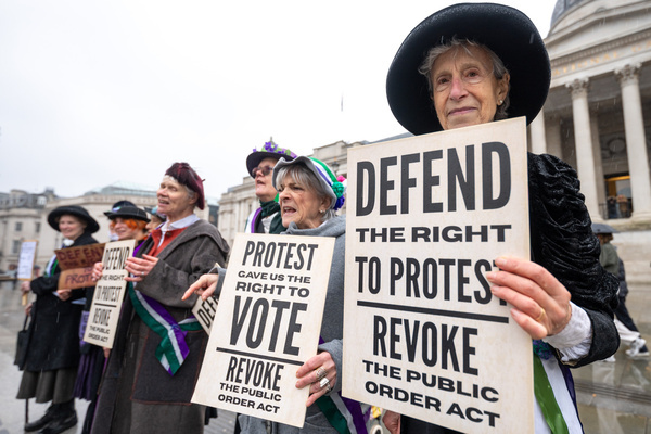 Protesters holding placards reading "Defend the right to protest, revoke the public order act" during the rally. Climate activists dressed as suffragettes gathered on the steps of the National Gallery in Trafalgar Square, London, ahead of International Women’s Day during a protest organised by Fossil Free London. Demonstrators called for the revocation of the Public Order Act, warning that recent legislation represents a rollback of protest rights in the UK. Activists referenced the sentencing of Just Stop Oil campaigners Phoebe and Anna, who received a combined three-year prison sentence for damaging the frame of a Van Gogh painting with soup, drawing comparisons with suffragette Mary Richardson, who served six months in prison in 1914 for slashing a Velázquez painting in the National Gallery.