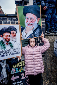 A young pro-Iranian regime British-Iranian girl holds aloft a poster of the Ayatollah Ali Khamenei who was killed in the joint US-Israeli attack. Many thousands congregated in Central London in an international demonstration of support for Palestinian rights. They were separated by Police from pro-Israeli and anti-Iranian-regime counter-protestors who met on the opposite side of the River Thames after the rally was banned from marching by the Home Secretary Shabana Mahmood. Rapper Bob Vylan spoke at the rally and is currently being investigated for chanting “Death to the IDF”.