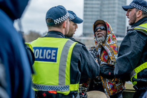 A pro-Palestinian musician activist is arrested under Section 14 of the Public Order Act 1986 for not dispersing after the rally. Many thousands congregated in Central London in an international demonstration of support for Palestinian rights. They were separated by Police from pro-Israeli and anti-Iranian-regime counter-protestors who met on the opposite side of the River Thames after the rally was banned from marching by the Home Secretary Shabana Mahmood. Rapper Bob Vylan spoke at the rally and is currently being investigated for chanting “Death to the IDF”.