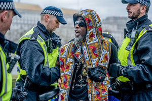 A pro-Palestinian musician activist is arrested under Section 14 of the Public Order Act 1986 for not dispersing after the rally. Many thousands congregated in Central London in an international demonstration of support for Palestinian rights. They were separated by Police from pro-Israeli and anti-Iranian-regime counter-protestors who met on the opposite side of the River Thames after the rally was banned from marching by the Home Secretary Shabana Mahmood. Rapper Bob Vylan spoke at the rally and is currently being investigated for chanting “Death to the IDF”.