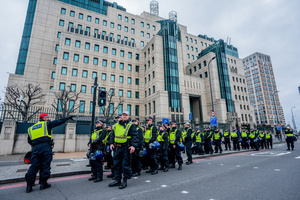 Police Officers patrolling the rally, march past the MI5 building in Vauxall, London. Many thousands congregated in Central London in an international demonstration of support for Palestinian rights. They were separated by Police from pro-Israeli and anti-Iranian-regime counter-protestors who met on the opposite side of the River Thames after the rally was banned from marching by the Home Secretary Shabana Mahmood. Rapper Bob Vylan spoke at the rally and is currently being investigated for chanting “Death to the IDF”.