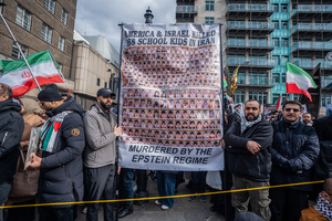 Pro-Iranian regime British-Iranians hold aloft a huge banner in remembrance of the 168 school children killed on the first day of the US-Israeli attack on Iran. Many thousands congregated in Central London in an international demonstration of support for Palestinian rights. They were separated by Police from pro-Israeli and anti-Iranian-regime counter-protestors who met on the opposite side of the River Thames after the rally was banned from marching by the Home Secretary Shabana Mahmood. Rapper Bob Vylan spoke at the rally and is currently being investigated for chanting “Death to the IDF”.