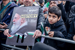 A pro-Iranian regime British-Iranian boy holds aloft a poster of the Ayatollah Ali Khamenei who was killed in the joint US-Israeli attack. Many thousands congregated in Central London in an international demonstration of support for Palestinian rights. They were separated by Police from pro-Israeli and anti-Iranian-regime counter-protestors who met on the opposite side of the River Thames after the rally was banned from marching by the Home Secretary Shabana Mahmood. Rapper Bob Vylan spoke at the rally and is currently being investigated for chanting “Death to the IDF”.