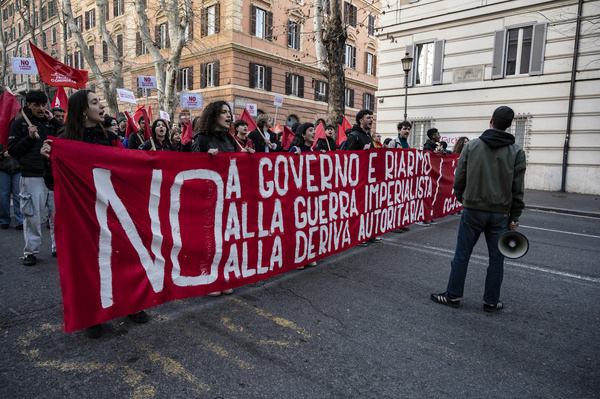 Protesters hold a banner during the demonstration. Around 10,000 people gathered in Rome on March 14 (“No Meloni Day”) to protest on several issues, including the war in the Middle East, concerns over freedom of speech, and opposition to proposed justice system reforms. Demonstrators united under the slogan “No Sociale” (“social no”), criticizing the reforms as a threat to the separation of powers. The rally also reflected growing political opposition and wider debate over government policies in Italy.