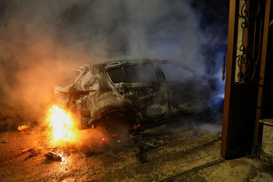 A car burns after an attack by Jewish settlers on the village of Deir al-Hatab, east of Nablus in the West Bank. Israeli settlers from Elon Moreh carried out attacks in several Palestinian villages, including Deir al-Hatab, following the funeral of 18-year-old Yehuda Sherman. Israeli police said Sherman died in a car collision with a Palestinian vehicle and are investigating whether it was deliberate or an accident. After the funeral, settlers set fire to homes and vehicles and spray-painted “revenge” in Hebrew, leaving at least 10 Palestinians injured, including one man shot and a woman treated for smoke inhalation.