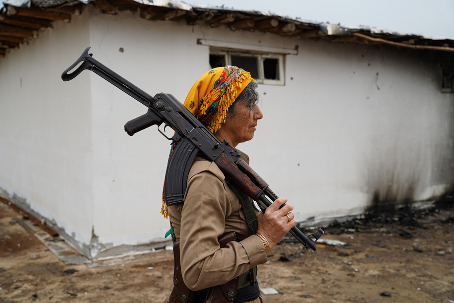 Nishtman Yousefi, a female Kurdish fighter and member of the Khabat Organization of Iranian Kurdistan (Sazmani Khabat), walks at their base near Erbil, the capital of the Kurdistan Region of Iraq, days after the site was targeted in a drone attack. Kurdish opposition fighters opposed to the Iranian regime have faced repeated missile and drone attacks from Iran in recent weeks amid the ongoing conflict involving the United States, Israel, and Iran. According to a member of the Khabat Organization of Iranian Kurdistan (Sazmani Khabat), a base was targeted by drones on March 13, killing two members and injuring four others at another military site.