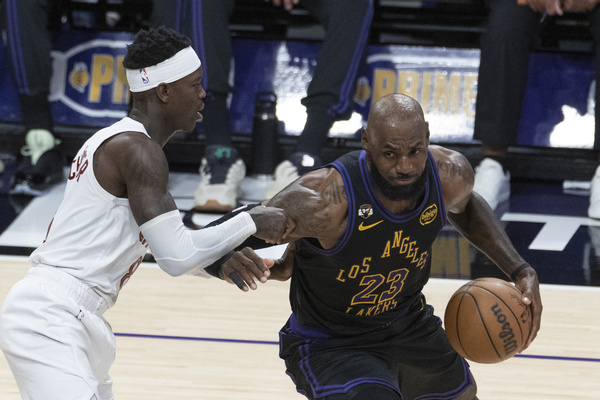 Los Angeles Lakers’ LeBron James (23) drives against Cleveland Cavaliers’ Dennis Schroder (8) during an NBA basketball game at Crypto.com Arena on Tuesday, March 31, 2026 in Los Angeles.
