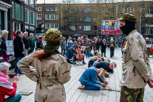Activists are seen performing as Israeli soldiers and others as Palestinian hostages during the rally. Activists performed as the Palestinian hostages held by the Israel government during a silent procession through the city to demand their release and against Israel's new execution law. With this protest, Nijmegen for Palestine wants to draw attention to the Palestinian hostages, who are often held for months, even years, without charge in appalling Israeli detention camps.