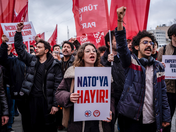 Young members of the Turkish Workers' Party chant slogans during an anti-NATO march. A large number of people gathered in Istanbul for a demonstration held on the anniversary of NATO's founding. The crowd, which assembled in front of the AKM (Atatürk Cultural Center), marched to Dolmabahçe Palace, calling for the dissolution of NATO and Turkey's withdrawal from the alliance.