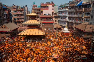 Nepalese devotees carry the chariot during the Festival. Sindoor Jatra or vermillion powder festival is celebrated each year to welcome the start of spring and Nepalese New Year, by playing a traditional instrument, singing, dancing, and carrying chariots of several gods and goddesses around the place.