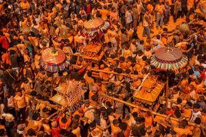 Nepalese devotees carry the chariot during the Festival. Sindoor Jatra or vermillion powder festival is celebrated each year to welcome the start of spring and Nepalese New Year, by playing a traditional instrument, singing, dancing, and carrying chariots of several gods and goddesses around the place.