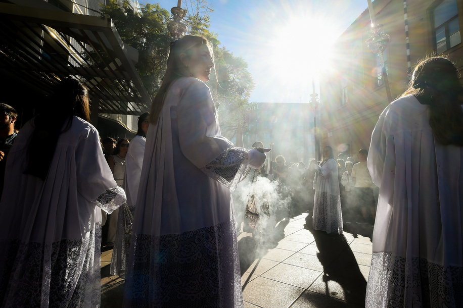 Penitents from 'Humillacion y estrella' brotherhood are seen carrying a censer as she takes part in a procession on Holy Tuesday to mark the Holy Week celebrations. Thousands of worshippers wait to see the processions with the statues of Christ and the Virgin Mary as part of the traditional Holy Week celebrations. In Andalusia, Easter brings together thousands of people from all over the world and it's considered one of the most important religious and cultural events of the year.