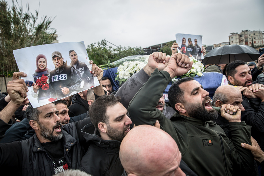 A coffin is carried through a cemetery in Choueifat, south of Beirut, during a funeral ceremony, for three journalists killed the previous day by Israeli airstrikes. Ali Shoeib, a reporter for Hezbollah-affiliated Al Manar TV, and Fatima Ftouni and her brother, cameraman Mohamed Ftouni, from the channel Al Mayadeen, were killed in Jezzine, southern Lebanon. At least 1,189 people have been killed in Lebanon since all-out war restarted between Israel and Hezbollah on March 2, says Lebanon's ministry of health.