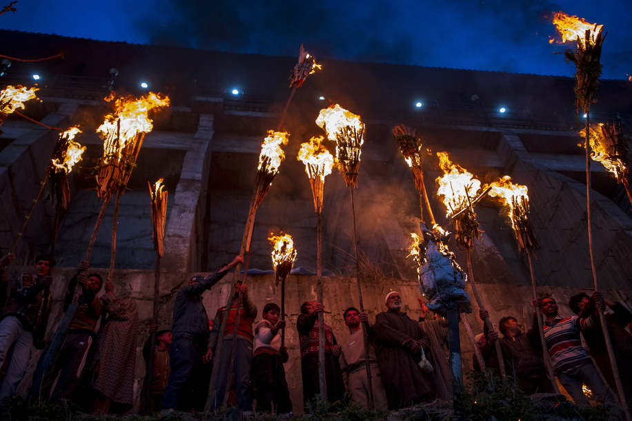 Kashmiri Muslims hold lit torches outside the cave shrine of Sakhi Zain-ud-din Wali, a Sufi saint, during an annual torch festival in Aishmuqam, 75 km (47 miles) south of Srinagar. Thousands of Muslim villagers in Indian-administered Kashmir gathered at a 15th-century Sufi saint's hilltop shrine for the annual torch festival, also known as the Zool Festival. Devotees lit wooden torches to honour the revered saint, marking the end of winter and the beginning of the paddy sowing season. Many believe this traditional torch festival commemorates the saint's victory over a demon that once terrorized local villagers. Flames illuminated the forested hillside as people paid obeisance at the mausoleum and took part in festivities that included traditional folk singing and musical performances.