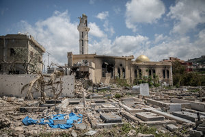 A damaged cemetery in the village of Mansouri, in southern Lebanon. After a 10-day ceasefire declared on April 16, 2026, displaced families in Lebanon began returning to assess widespread destruction from weeks of fighting that killed over 2,400 people. Many homes, hospitals, and key infrastructure were damaged, while more than one million people remain displaced. Despite the pause, access to some areas is restricted, and fears persist that fighting could resume.