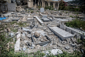 A damaged cemetery in the village of Mansouri, in southern Lebanon. After a 10-day ceasefire declared on April 16, 2026, displaced families in Lebanon began returning to assess widespread destruction from weeks of fighting that killed over 2,400 people. Many homes, hospitals, and key infrastructure were damaged, while more than one million people remain displaced. Despite the pause, access to some areas is restricted, and fears persist that fighting could resume.