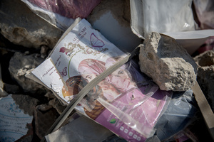 A clothing packet seen in rubble in the village of Mansouri, in southern Lebanon. After a 10-day ceasefire declared on April 16, 2026, displaced families in Lebanon began returning to assess widespread destruction from weeks of fighting that killed over 2,400 people. Many homes, hospitals, and key infrastructure were damaged, while more than one million people remain displaced. Despite the pause, access to some areas is restricted, and fears persist that fighting could resume.