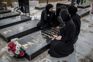Women pray by the grave of their father, who was killed in 2024, at a cemetery in the village of Majdal Zoun, Tyre district. After a 10-day ceasefire declared on April 16, 2026, displaced families in Lebanon began returning to assess widespread destruction from weeks of fighting that killed over 2,400 people. Many homes, hospitals, and key infrastructure were damaged, while more than one million people remain displaced. Despite the pause, access to some areas is restricted, and fears persist that fighting could resume.