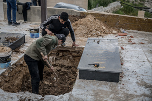 Men prepare graves in a cemetery in the village of Majdal Zoun, Tyre district. After a 10-day ceasefire declared on April 16, 2026, displaced families in Lebanon began returning to assess widespread destruction from weeks of fighting that killed over 2,400 people. Many homes, hospitals, and key infrastructure were damaged, while more than one million people remain displaced. Despite the pause, access to some areas is restricted, and fears persist that fighting could resume.