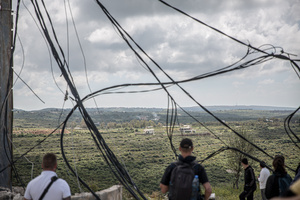 Journalists watch what they believe are controlled Israeli demolitions from the village of Majdal Zoun, Tyre district. After a 10-day ceasefire declared on April 16, 2026, displaced families in Lebanon began returning to assess widespread destruction from weeks of fighting that killed over 2,400 people. Many homes, hospitals, and key infrastructure were damaged, while more than one million people remain displaced. Despite the pause, access to some areas is restricted, and fears persist that fighting could resume.
