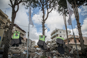 Vests are hung on a fence to remember paramedics who were killed working for the Hezbollah-linked Islamic Health Authority in Jibchit, southern Lebanon. After a 10-day ceasefire declared on April 16, 2026, displaced families in Lebanon began returning to assess widespread destruction from weeks of fighting that killed over 2,400 people. Many homes, hospitals, and key infrastructure were damaged, while more than one million people remain displaced. Despite the pause, access to some areas is restricted, and fears persist that fighting could resume.