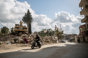 A man on a motorbike drives by a pile of rubble during a 10-day ceasefire between Israel and Hezbollah. Many displaced people used the opportunity to check on their homes. After a 10-day ceasefire declared on April 16, 2026, displaced families in Lebanon began returning to assess widespread destruction from weeks of fighting that killed over 2,400 people. Many homes, hospitals, and key infrastructure were damaged, while more than one million people remain displaced. Despite the pause, access to some areas is restricted, and fears persist that fighting could resume.