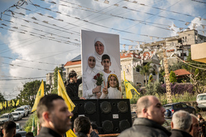Pictures of three children - Narges (8), Mohammed (11) and Zainab (15) - their mother, Khadija, are carried at their funeral in Jibchit, Nabatieh district. Civilians killed in heavy bombardment were buried in a mass funeral in the village of Jibchit, southern Lebanon. Families returned during a temporary ceasefire to lay victims, many killed in earlier strikes, to rest after being unable to access the cemetery. Mourners carried coffins through the damaged village, reflecting the heavy civilian toll of the conflict.