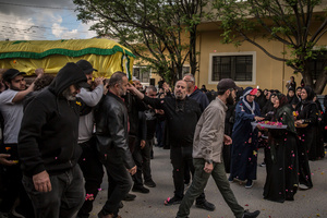Coffins are carried during the funeral of three children—Narges, 8; Mohammed, 11; and Zainab, 15—and their mother, Khadija, in Jibchit, Nabatieh district. The family was killed in an Israeli airstrike while displaced. Civilians killed in heavy bombardment were buried in a mass funeral in the village of Jibchit, southern Lebanon. Families returned during a temporary ceasefire to lay victims, many killed in earlier strikes, to rest after being unable to access the cemetery. Mourners carried coffins through the damaged village, reflecting the heavy civilian toll of the conflict.
