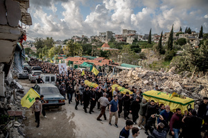 Coffins are carried during the funeral of three children—Narges, 8; Mohammed, 11; and Zainab, 15—and their mother, Khadija, in Jibchit, Nabatieh district. The family was killed in an Israeli airstrike while displaced. Civilians killed in heavy bombardment were buried in a mass funeral in the village of Jibchit, southern Lebanon. Families returned during a temporary ceasefire to lay victims, many killed in earlier strikes, to rest after being unable to access the cemetery. Mourners carried coffins through the damaged village, reflecting the heavy civilian toll of the conflict.