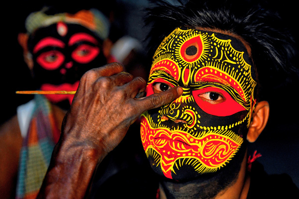 Hindu boy poses for picture as they attend and celebrate Bengal New Year festival called Gajan at west Bengal area. Gajan is associated with the gods Shiva, Neel and Dharmathakur. The festival starts at the last week of Choitro continuing till the end of the Bengali year. Participants of this festival are known as Sannyasi or Bhokta. The central theme of this festival is deriving satisfaction through non-sexual pain, devotion and sacrifice.