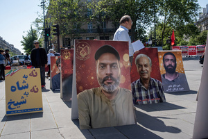 The People's Mojahedin Organization of Iran also known as Mojahedin-e-Khalq display photos of the victims of the Iranian demonstrations in Paris during the May Day protest. Tens of thousands of trade unionists and grassroots activists gathered in Paris to celebrate the achievements of the labor movement and raise awareness of workers’ rights.
