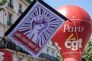 Confédération Générale du Travail (CGT) is a trade union. Its flag and balloon flies at the wind during the May Day celebration in Paris. Tens of thousands of trade unionists and grassroots activists gathered in Paris to celebrate the achievements of the labor movement and raise awareness of workers’ rights.