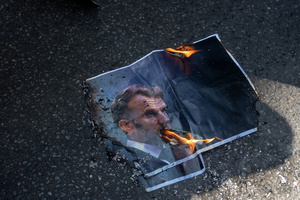 The photo of the French President Emmanuel Macron set on fire during the May Day demonstration in Paris. Tens of thousands of trade unionists and grassroots activists gathered in Paris to celebrate the achievements of the labor movement and raise awareness of workers’ rights.