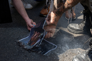The photo of the French President Emmanuel Macron set on fire during the May Day demonstration in Paris. Tens of thousands of trade unionists and grassroots activists gathered in Paris to celebrate the achievements of the labor movement and raise awareness of workers’ rights.
