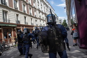 Riot police charges towards the protesters during the May Day demonstration in Paris. Tens of thousands of trade unionists and grassroots activists gathered in Paris to celebrate the achievements of the labor movement and raise awareness of workers’ rights.