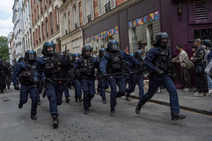 Riot police charges towards the protesters during the May Day demonstration in Paris. Tens of thousands of trade unionists and grassroots activists gathered in Paris to celebrate the achievements of the labor movement and raise awareness of workers’ rights.