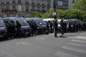 Riot police ready to intervene to the demonstration while they stand by the road during the May Day protest in Paris. Tens of thousands of trade unionists and grassroots activists gathered in Paris to celebrate the achievements of the labor movement and raise awareness of workers’ rights.