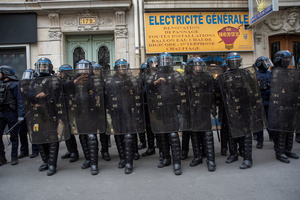 Riot police ready to intervene to the demonstration while they stand by the road during the May Day protest in Paris. Tens of thousands of trade unionists and grassroots activists gathered in Paris to celebrate the achievements of the labor movement and raise awareness of workers’ rights.