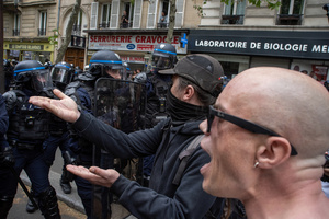 Protesters confront the riot police during the May Day demonstration in Paris. Tens of thousands of trade unionists and grassroots activists gathered in Paris to celebrate the achievements of the labor movement and raise awareness of workers’ rights.