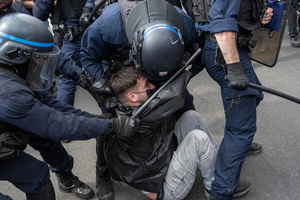 Riot police arrest a protester during the May Day demonstration in Paris. Tens of thousands of trade unionists and grassroots activists gathered in Paris to celebrate the achievements of the labor movement and raise awareness of workers’ rights.