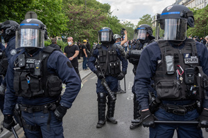 A riot police holds a tear gas gun during the May Day demonstration in Paris. Tens of thousands of trade unionists and grassroots activists gathered in Paris to celebrate the achievements of the labor movement and raise awareness of workers’ rights.