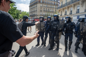 Protesters confront the riot police during the May Day demonstration in Paris. Tens of thousands of trade unionists and grassroots activists gathered in Paris to celebrate the achievements of the labor movement and raise awareness of workers’ rights.