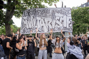 Protesters hold banner and chant slogans during the May Day demonstration in Paris. Tens of thousands of trade unionists and grassroots activists gathered in Paris to celebrate the achievements of the labor movement and raise awareness of workers’ rights.
