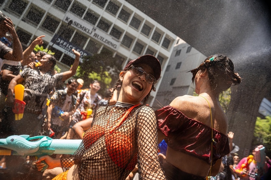 Participants dance among the crowd during the Songkran celebrations in Bangkok, as water falls around them. The kickoff of Songkran on Silom Road marks the start of Thailand’s New Year with one of Bangkok’s most iconic celebrations. Traditionally rooted in rituals of cleansing and renewal, the festival has evolved into a vibrant public event where crowds gather for large-scale water fights. Silom, with its central location and lively atmosphere, has become a key hotspot, drawing both locals and visitors into the heart of the festivities.