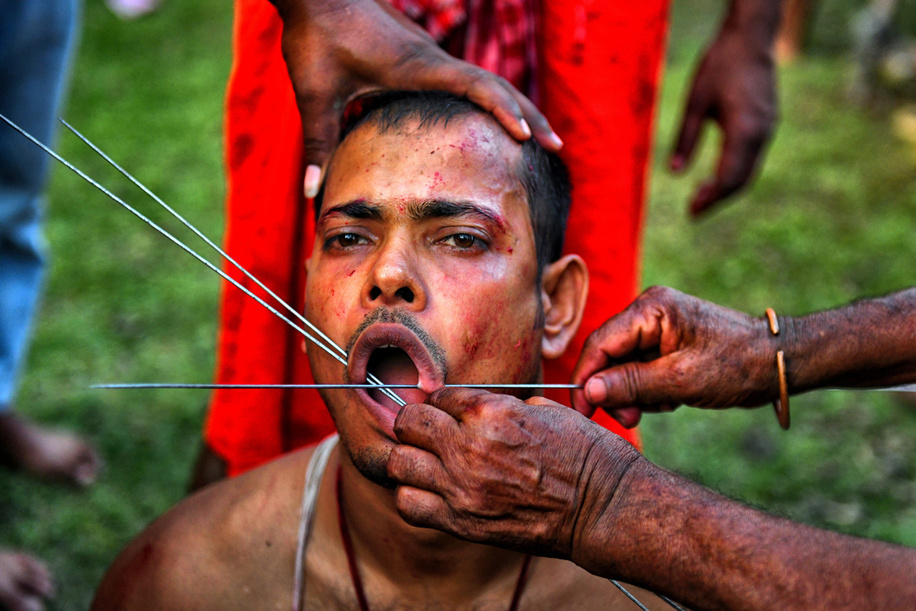 (EDITORS NOTE: Image contains graphic content) 
A Hindu devotee is pierced with sharp needles during Charak Puja Celebration. The Charak Festival is one of the oldest Folk festivals where devotees show their faith by self inflicting pain on themselves, in the belief that Lord Shiva will help them overcome troubles in their daily lives.