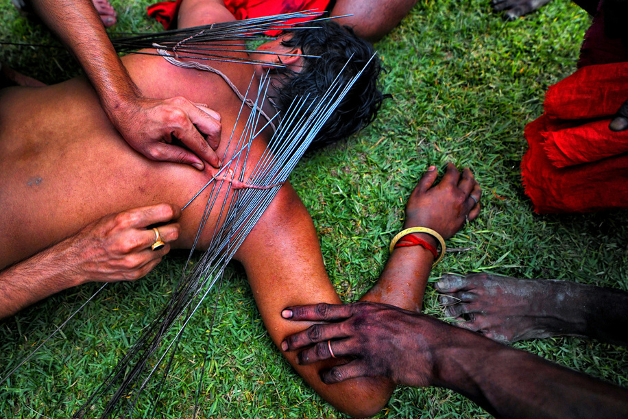(EDITORS NOTE: Image contains graphic content) 
A Hindu devotee is pierced with sharp needles during Charak Puja Celebration. The Charak Festival is one of the oldest Folk festivals where devotees show their faith by self inflicting pain on themselves, in the belief that Lord Shiva will help them overcome troubles in their daily lives.
