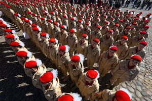 A large group of the Yunarmia youth movement members in signature red berets standing in formation during a festive flash mob at the Peter and Paul Fortress. A large-scale theatrical reconstruction and flash mob titled "Victory Ball" (Bal Pobedy) takes place on the Cathedral Square of the Peter and Paul Fortress. The event is dedicated to the 81st anniversary of the victory in World War II (WWII). Hundreds of participants, including youth activists, members of the Yunarmia movement, and students in historical and modern military uniforms, perform mass dances and formations. The reconstruction is part of the city-wide celebrations ahead of Victory Day in St. Petersburg.