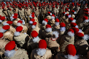 A large group of the Yunarmia youth movement members in signature red berets standing in formation during a festive flash mob at the Peter and Paul Fortress. A large-scale theatrical reconstruction and flash mob titled "Victory Ball" (Bal Pobedy) takes place on the Cathedral Square of the Peter and Paul Fortress. The event is dedicated to the 81st anniversary of the victory in World War II (WWII). Hundreds of participants, including youth activists, members of the Yunarmia movement, and students in historical and modern military uniforms, perform mass dances and formations. The reconstruction is part of the city-wide celebrations ahead of Victory Day in St. Petersburg.