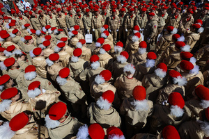 A large group of the Yunarmia youth movement members in signature red berets standing in formation during a festive flash mob at the Peter and Paul Fortress. A large-scale theatrical reconstruction and flash mob titled "Victory Ball" (Bal Pobedy) takes place on the Cathedral Square of the Peter and Paul Fortress. The event is dedicated to the 81st anniversary of the victory in World War II (WWII). Hundreds of participants, including youth activists, members of the Yunarmia movement, and students in historical and modern military uniforms, perform mass dances and formations. The reconstruction is part of the city-wide celebrations ahead of Victory Day in St. Petersburg.